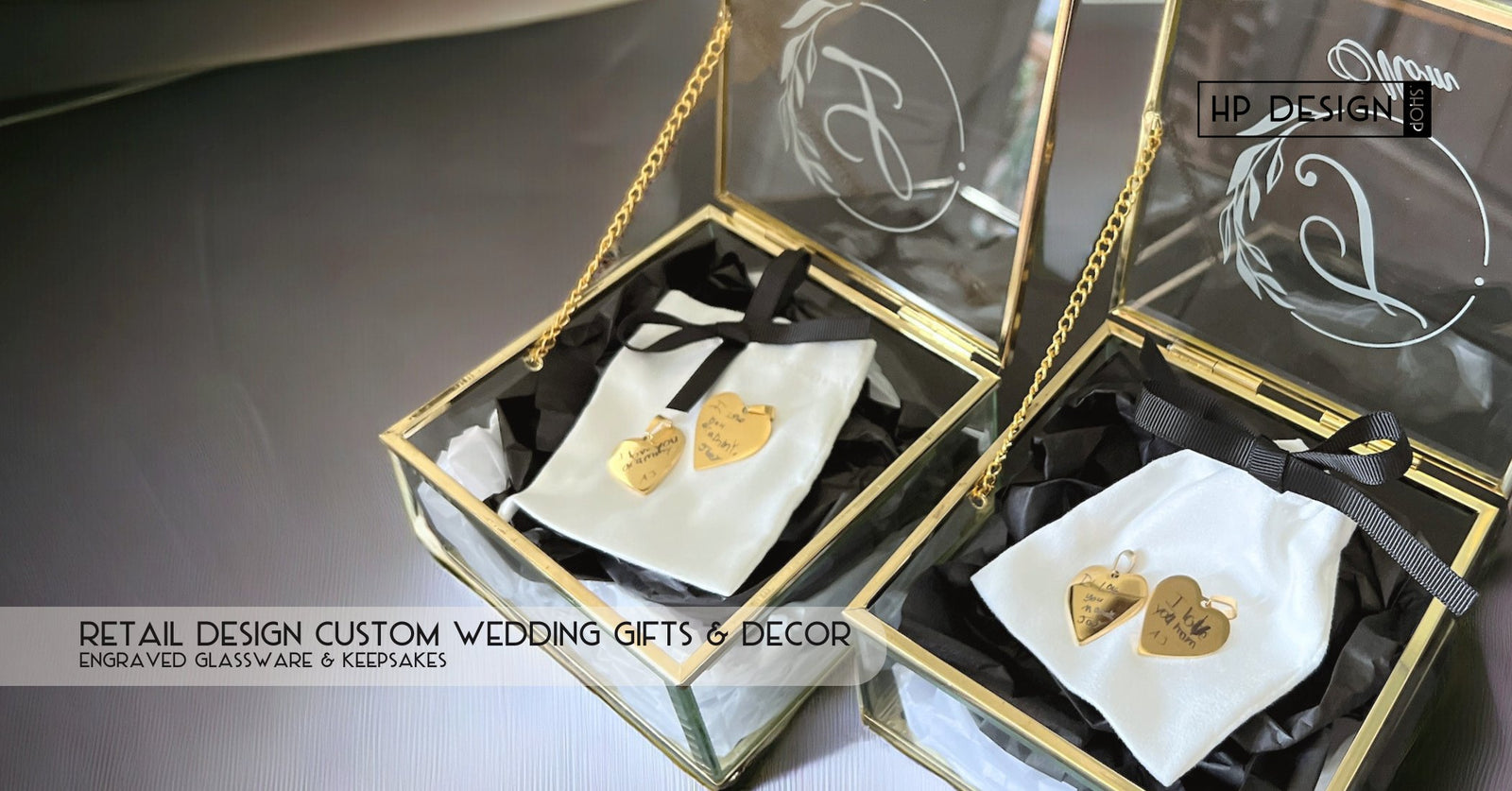Two elegant glass boxes containing personalized wedding gifts, including small engraved wooden hearts. The title reads 'Retail Design Custom Wedding Gifts & Décor – Explore HP Design's Custom Creations.