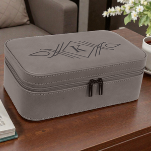 Gray travel case with a logo on a wooden surface