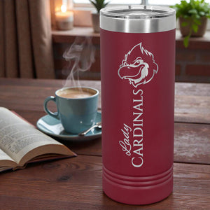 Maroon thermos with 'Cardinals' logo on a wooden table with a cup of coffee and book.