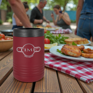 Red insulated cup with 'TIME' logo on a wooden table with food and people in the background